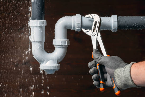 Professional Drain Cleaning technician working in Russellville, AL